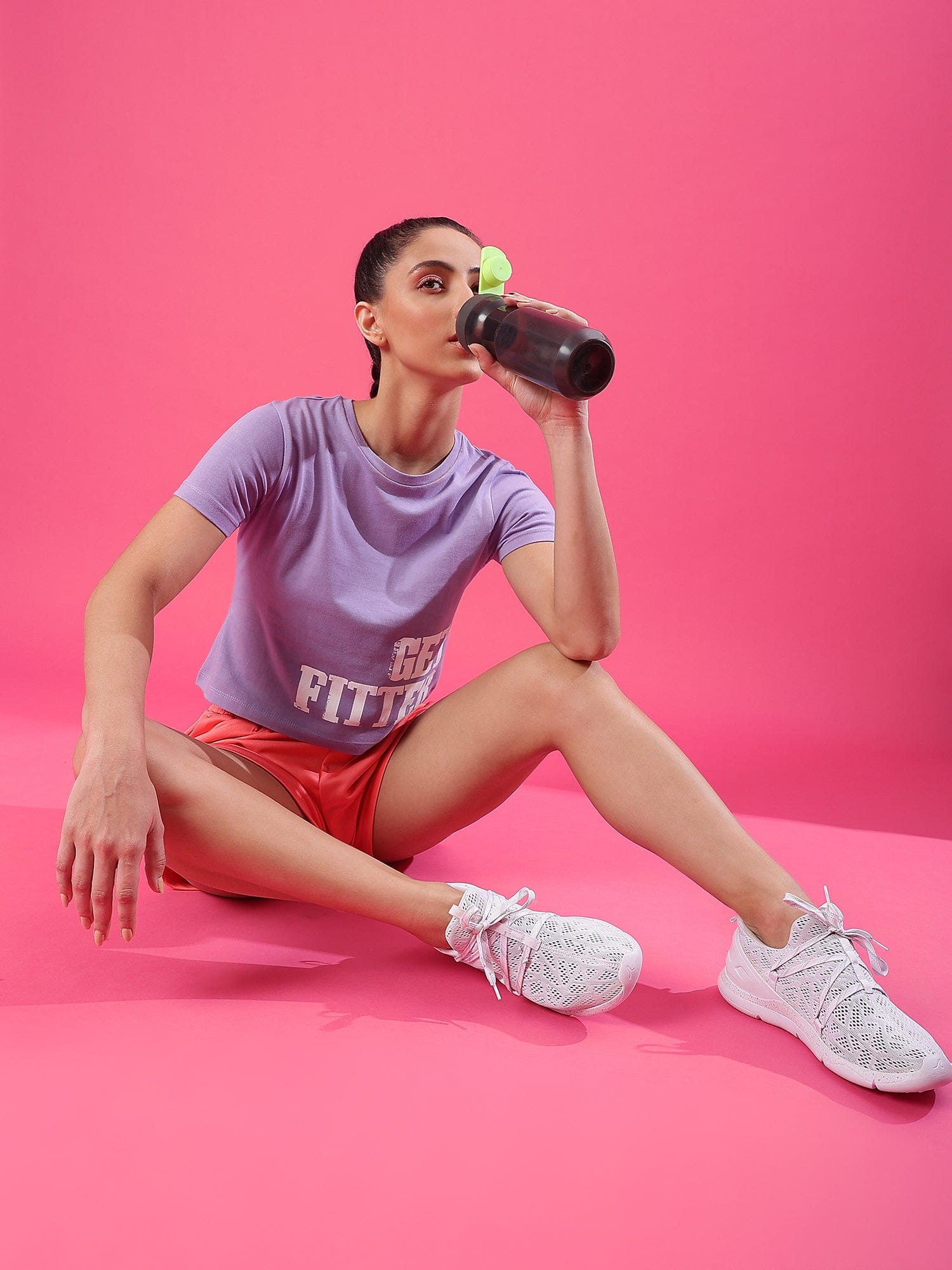 women drinking water with DRYP athleisure tshirt and athleisure boxer