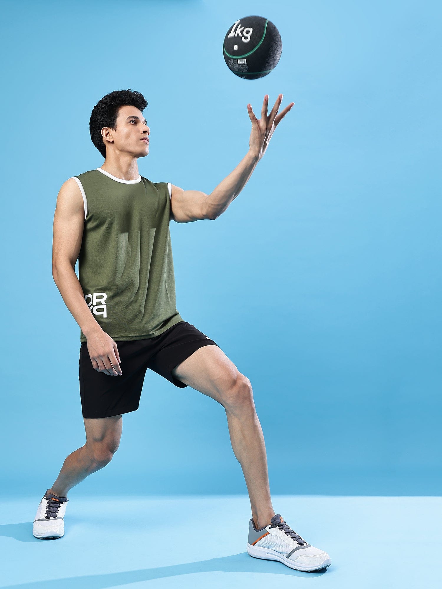 man playing volleyball with DRYP athleisure tshirt and athleisure short